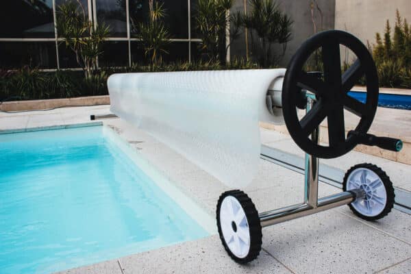 clear solar pool cover on roller